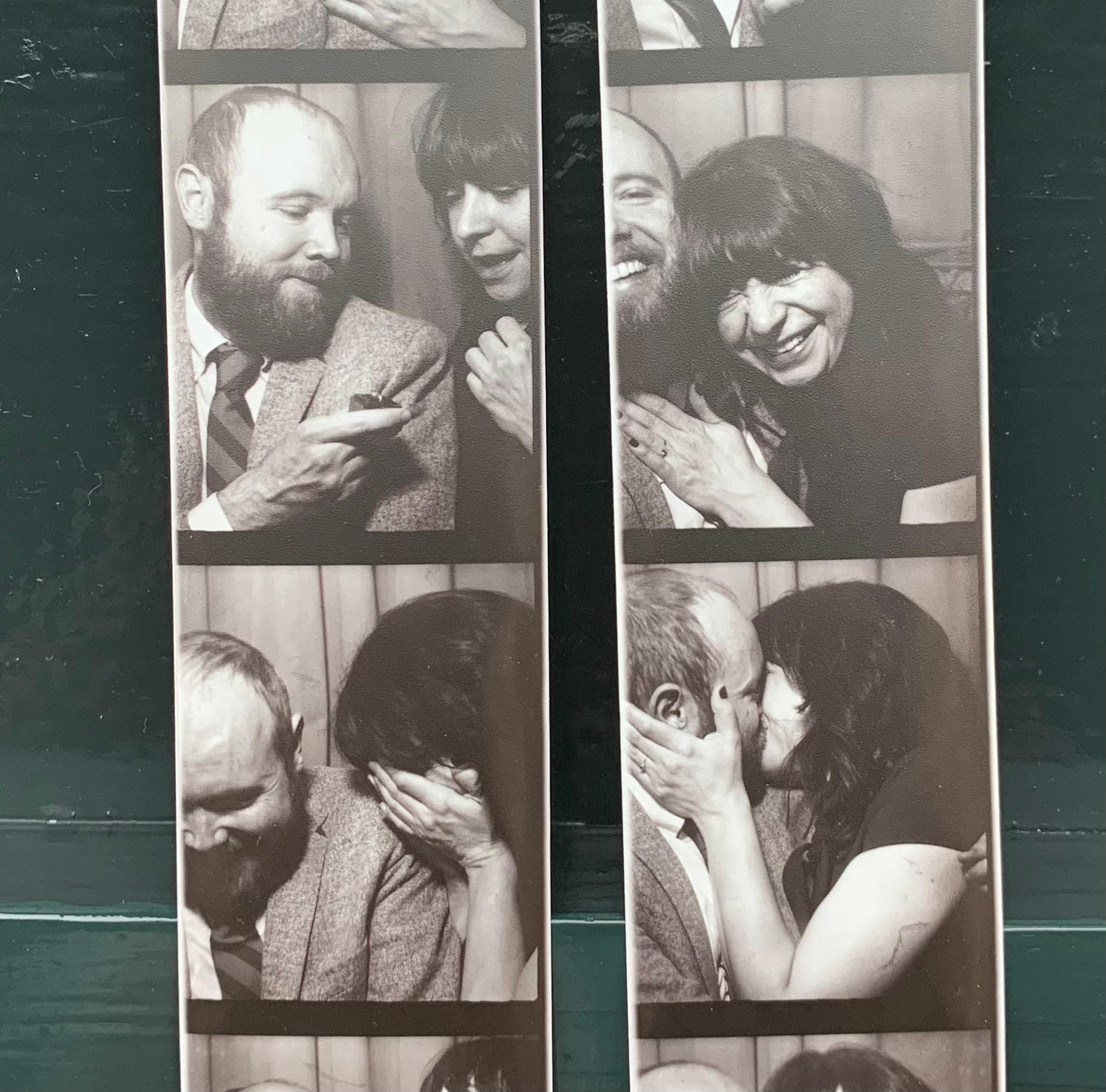 Engagement photo of the couple outside the Music Box Theater